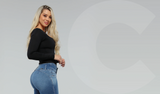 Blonde showing off the effectiveness of waist cinchers