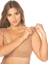 Model showing off the strap functionality of the shapewear bra.