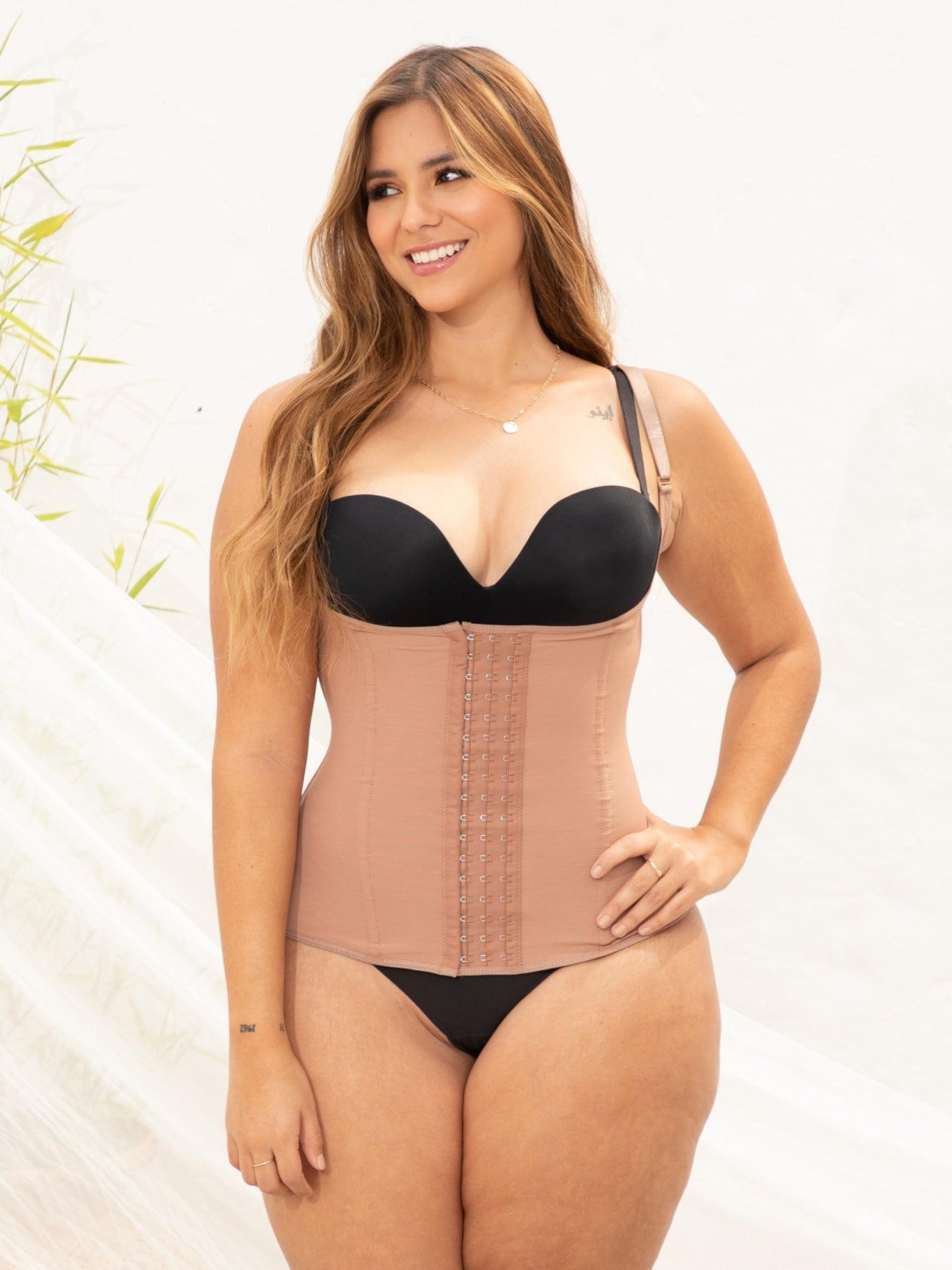 Full upper body view of a semi vest waist cincher.